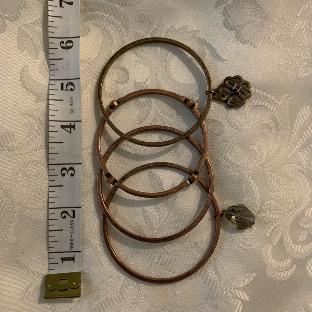 Set of copper coloured Bangles with Charm